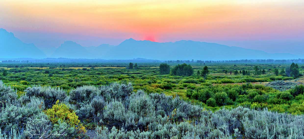 sunset over teton mountains