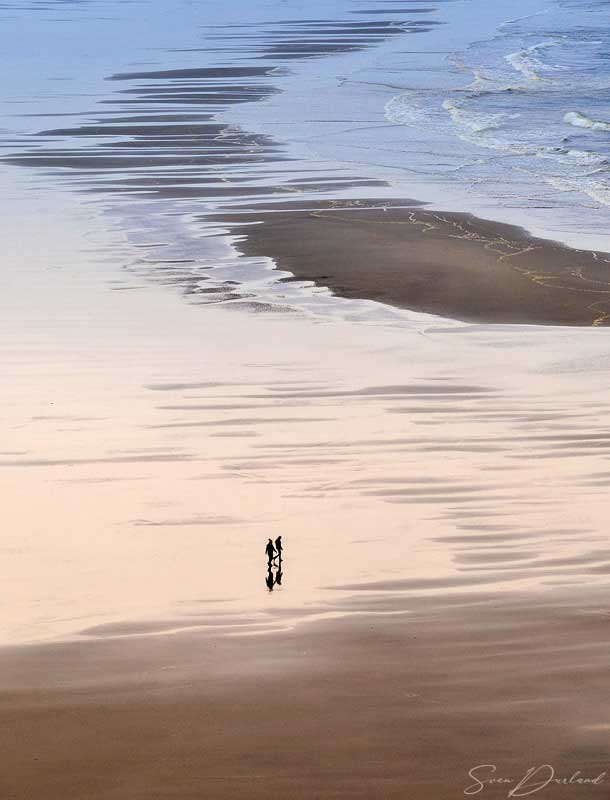 A couple walking in shallow waster